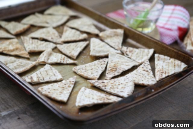 sheet pan filled with pita triangles before baking